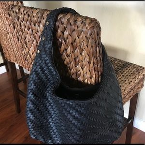 Black woven handbag with gold detail